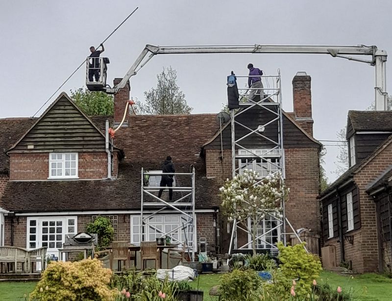 The Moss Cleaners using cherry picker and scaffolding to clean roof safely and professionally in 67 Lansdowne Rd, Croydon CR0 2BF, UK, 67 Lansdowne Rd, Croydon CR0 2BF, UK